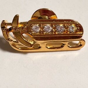 Elegant Gold tone, ski snowmobile, with rhinestones Brooch